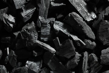 Heap of coal as background, top view