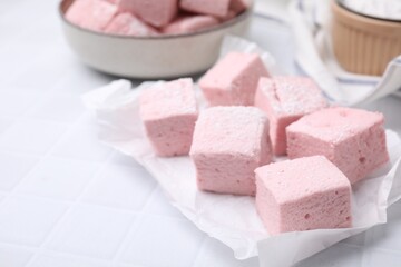 Delicious sweet marshmallows on white table, closeup. Space for text