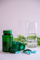 bottles and pills with liquid