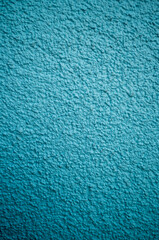 Fototapeta na wymiar Profile View of a Turquoise Blue Building Wall.