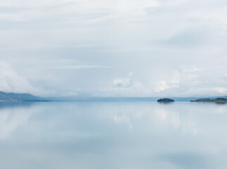 Tranquil and still waters of Lake Pukaki, at the foot of Mount Cook, New Zealand