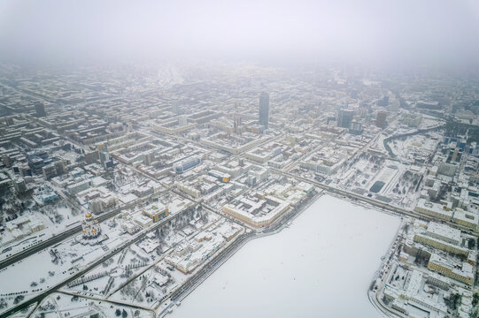 Embankment of the central pond and Plotinka in Yekaterinburg at winter sunset. The historic center of the city of Yekaterinburg, Russia, Aerial View