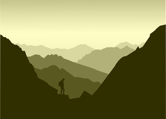 morning silhouettes of mountains on a green background with a tourist
