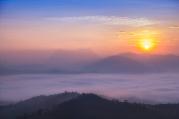 Beautiful Sunrise over mountain range and sea of fog flowing on hill as seen from Den TV View...