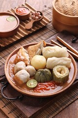 Siomay or Somay is a typical West Javanese food made from fish, vegetables, potatoes steamed and served with peanut sauce, sauce and soy sauce