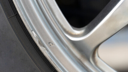 Chipped abrasion of alloy wheels around the edge of the wheel. Repair of car wheels.