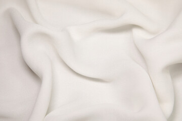 Fototapeta premium White fabric background. White cloth waves background texture. White fabric cloth textile material.