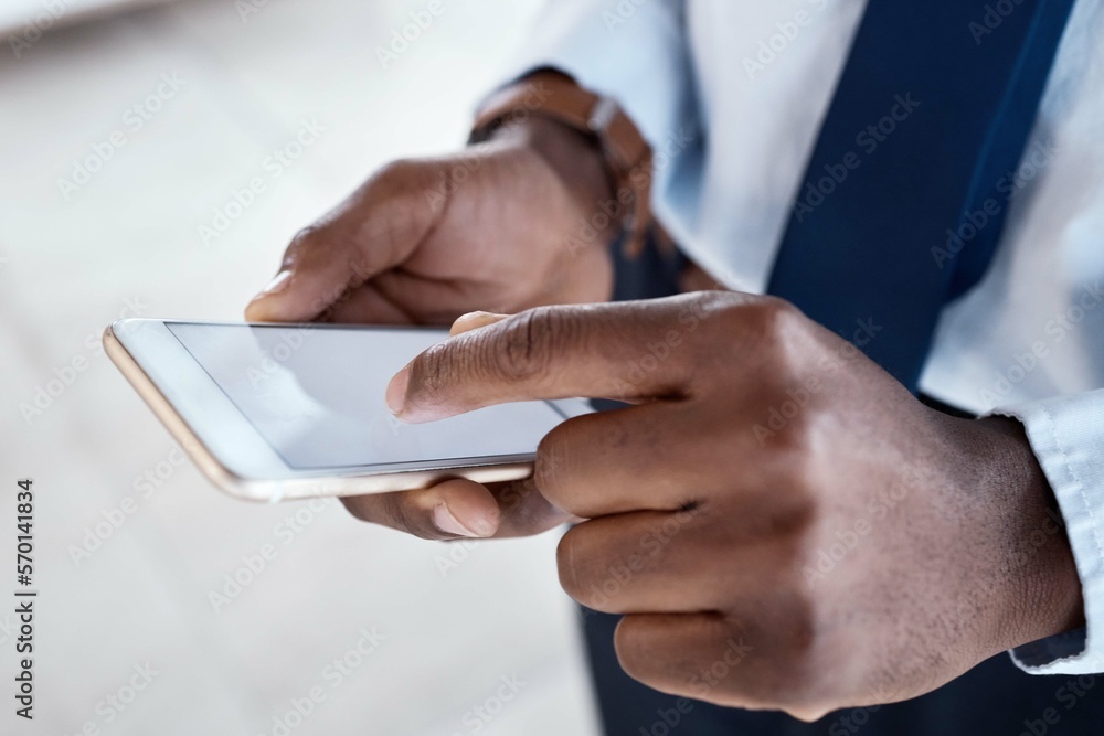 Poster hands, phone screen and black man in office with typing, communication and texting on chat app. busi