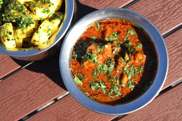hicken curry. Pahadi chicken masala is a famous Spicy nonvegetarian dish of north India. It's made out of chicken meat along with spices and garnished with fresh coriander. copy space.