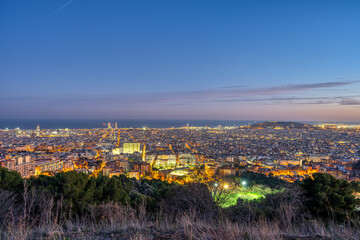 Fototapeta na wymiar The skyline of Barcelona in Spain at dusk