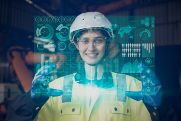 happy engineer female worker using advance technology digital hologram infographics touch panel in industry factory.