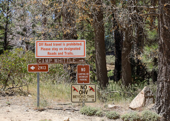 The Camp Whittle sign and other information sign at Big Bear Lake in southern California USA.