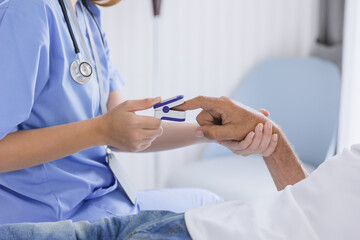 Obraz na płótnie Canvas closeup nurse doctor using fingertip pause oximeter measures blood oxygen saturation level with patient