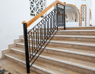 Fence with wooden railing on the stairs as a background.