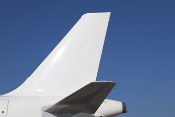 white tail fin of an passenger plane - obrazy, fototapety, plakaty