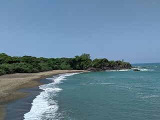 virgin beach on the sea with a very healthy forest full of trees and blue water in veracruz, roca partida region, tuxtlas, mexico, america, spring season