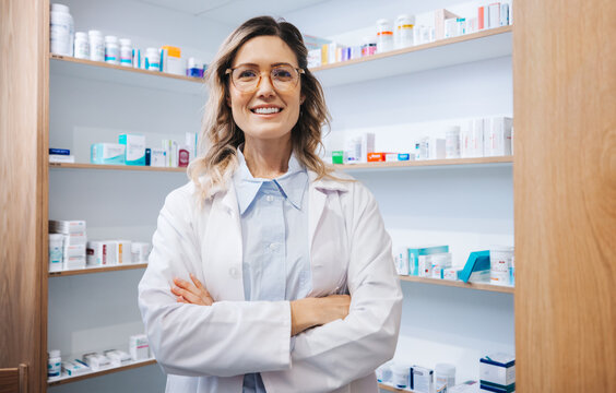 Portrait of a female pharmacist standing in a drug store