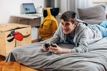 Caucasian teenage boy is passionate about gaming