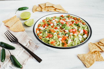 Bowl of mexican guacamole with fresh ingredients in Mexico Latin America top view 