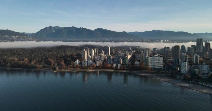 Aerial of fog over the West End and Stanely Park in Vancouver, British Columbia