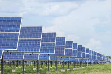 rows array of polycrystalline silicon solar cells or photovoltaic cells in solar power plant station turn up skyward absorb the sunlight from the sun  - 570178466