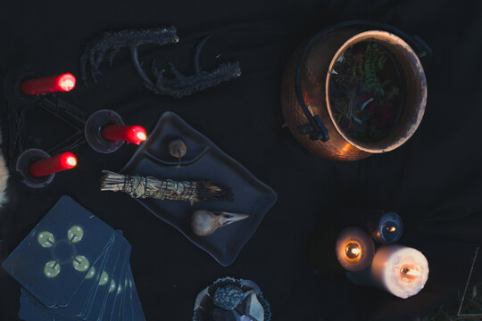 Close up preparing for occult practice concept photo. Dark witchcore aesthetic. Top view photography with blurred background. High quality picture for wallpaper, travel blog, magazine, article