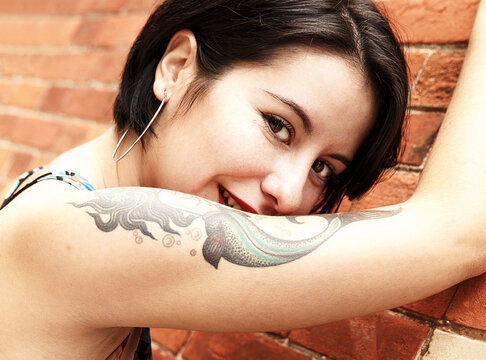beauty woman leaning on brick wall, spain