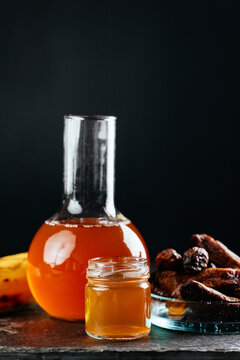 berry tinctures in shorts with fruit and berries on the backgrou