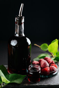 berry tinctures in shorts with fruit and berries on the backgrou