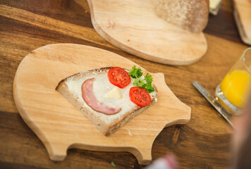 Piece of bread and butter formed like a smiling face