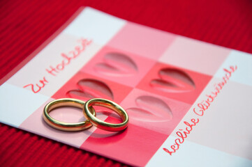 Wedding rings on wedding card, close up