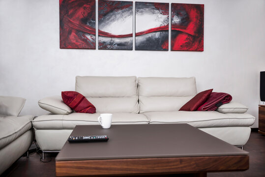 Remote control with coffee cup on table, Munich, Bavaria, Germany