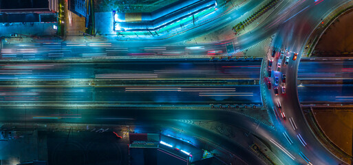 Expressway top view, Road traffic an important infrastructure, car traffic transportation above intersection road in city night, aerial view cityscape of advanced innovation, financial technology	
