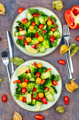 Spring vegetable salad decorated with physalis.