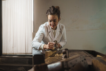 Female woodworker Restoration in her workplace