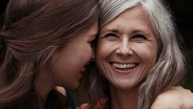 Close mother and daughter have a happy moment together