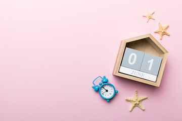 June 1th. Image of june 1 wooden calendar on colored background. Summer day. Empty space for text