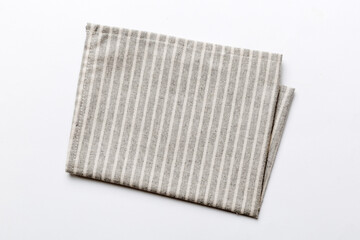 top view with gray kitchen napkin isolated on table background. Folded cloth for mockup with copy...