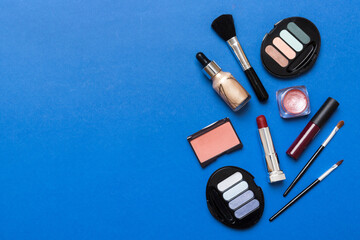 Professional makeup tools. Top view. Flat lay. Beauty, decorative cosmetics. Makeup brushes set and color eyeshadow palette on table background. Minimalistic style