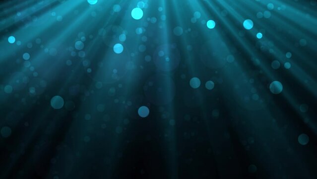 Teal color air particles and rays glittering on black background. Bokeh shiny particles loop animation