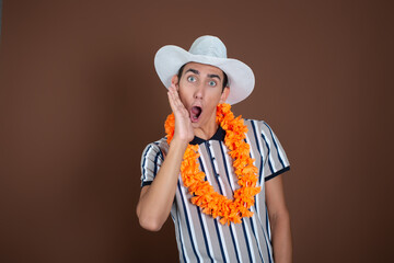 Cheerful young man in a hat and sunglasses. Long awaited vacation. Joyful emotions. Copy Space.