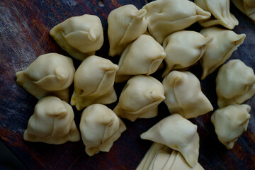 Uncooked delicious street food called Singara locally, popular breakfast item made with wheat and potatoes,spicy indian junk food 