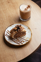 meringue dessert and coffee in a cup
