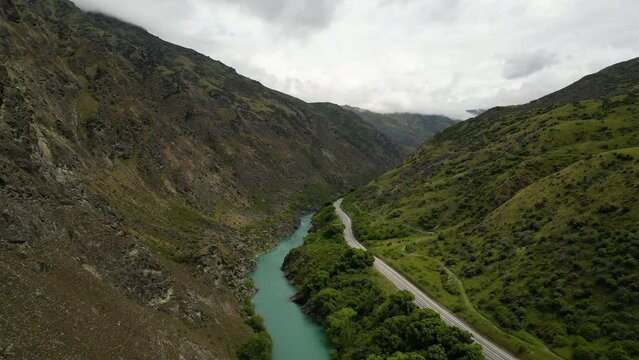 River that flows from Cromwell to Roxburgh, cycling tour near vineyard. Aerial