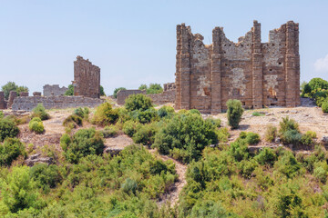Fototapeta na wymiar Aspendos Ancient City. Acropolis city ruins, nymphaeum, part of water supply system. Aspendos, Antalya region, Turkey (Turkiye).