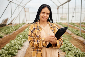 Greenhouse, agriculture portrait and black woman with vegetables inspection, agro business and food...