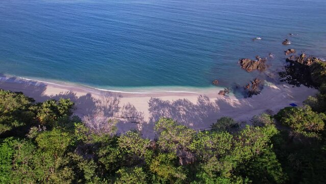Playa Conchal, located on the coast of Guanacaste Costa Rica. Calm waves, white sand and blue water.