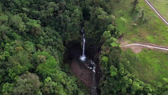 Waterfall in the mountains of Sarchi in Costa Rica, its name is Rio Agrio, a place with a great climate perfect to visit with the family.