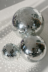 glass balls glisten in the sun on a white background