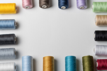 bobbins of sewing thread on white background